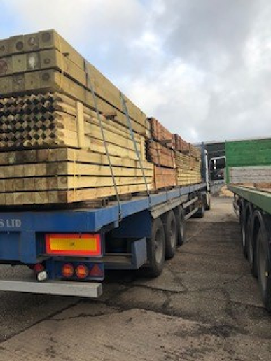 mixed fence posts on a lorry